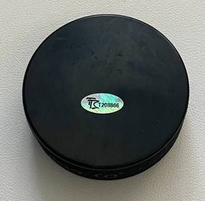 lot 311 image: Buzz Schneider Signed Hockey Puck - 1980 Miracle on Ice with Fan HQ COA