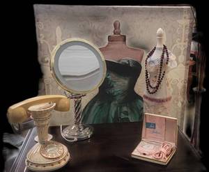 lot 3 image: Nine-piece Lot with 1960s pink laundry hamper, a pink Vintage Electric ladys Shaver, Pin Cushion, Makeup Mirror with light, Tassel Lamp, High Cradle Telephone