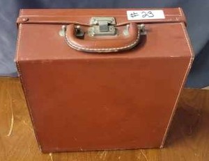 lot 23 image: Vintage Polaroid Camera with Flash Attachment and Extra Bulbs In a Brown Case