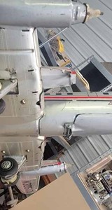 lot 103 image: American Airlines Electra Flagship N 305AA, a Small Diecast Delta Airlines Plane, and a Dambusters Jet