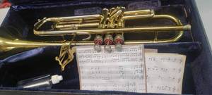 lot 148 image: Vintage Conn Brass Cornet with Authentic Conn Case and Sheet Music
