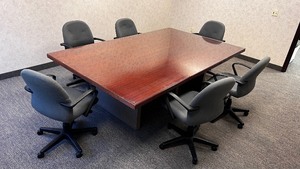 lot 3 image: Conference Room Table With 6 Chairs and Glass Top.