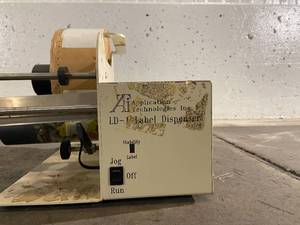 Application Technologies Label Dispenser with Bin of Labels
