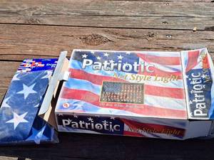 lot 1304 image: Lot of (2) Home Dcor - Patriotic Net Style Light 150-bulb (in box) and USA Flag 3x5 (in package)