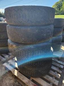 Lot of (4) Bridgestone M800 24570R19.5 136134J Skid Loader Tubeless Snow Tires with 8-lug Rims