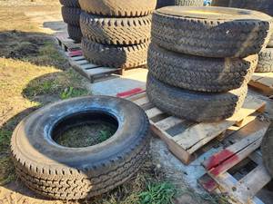 Lot of (4) Firestone Transforce AT LT23585R16 Skid Loader Tires with 8-lug Rims (x3)