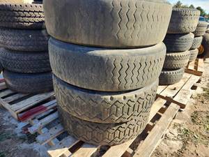 Lot of (4) Dunlop Dectes SP001 24570R19.5 Skid Loader Tires with 8-lug Rims