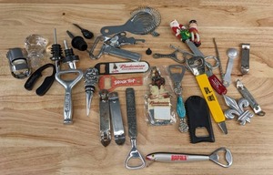 lot 208 image: Collection of Bottle Openers, Wine Bottle Stoppers, Stainless Steel Cocktailer Strainer, & More D