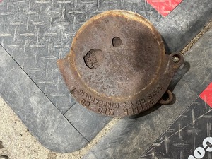 Tote of old cook stove lids  handles  and legs