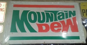 lot 286 image: Mountain Dew Vintage Metal Sign.