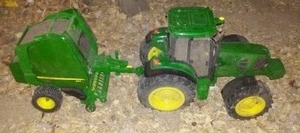 lot 311 image: John Deere Plastic Tractor And Baler Toy.