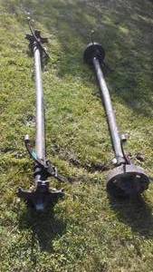 lot 345 image: Pair Of Axles With Hubs, Electric Brakes
