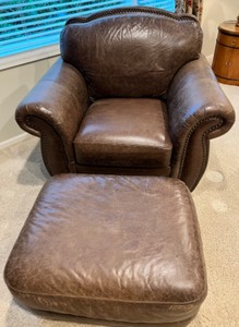 lot 101 image: LEATHER TREND Full Grain Chair and Ottoman with Nailhead Trim
