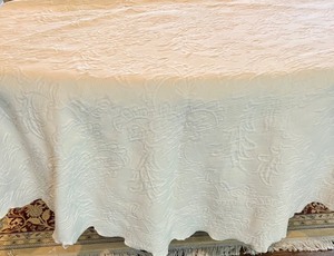 lot 92 image: Round Quilted Ivory Tablecloth