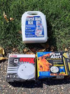 lot 1424 image: (2) Smoke Alarms and (1) First Aid Kit (in original packaging)
