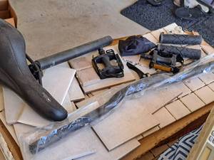 lot 1461 image: Assorted Bicycle Parts - Seat and Seatpost, Pedals, Grips, Handlebars