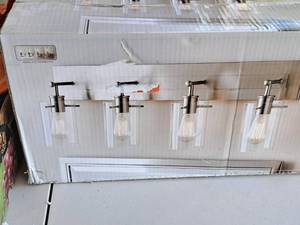 lot 1508 image: Hampton Bay Reagan Brushed NickelClear Glass Vanity Light Fixture 4-bulb (in original box)