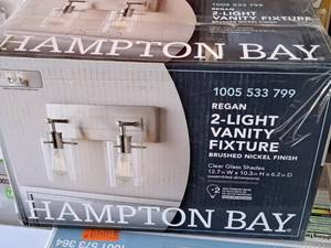 lot 1530 image: Hampton Bay Reagan Brushed NickelClear Glass Shade Vanity Light Fixture 2-bulb (in original box)