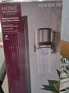 lot 1543 image: Home Decorators Collection Majestic BlackClear Crackle Glass Shade LED Medium Exterior Wall Lantern (in original box)