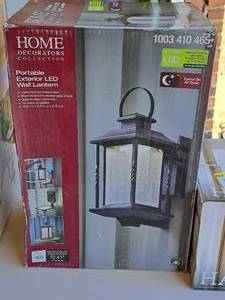 lot 1546 image: Home Decorators Collection BlackSeeded Glass Shade Portable Exterior LED Wall Lantern (in original box)