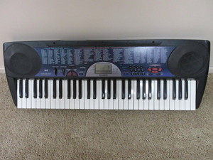 lot 105 image: CASIO SYNTHESIZER