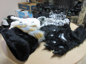lot 155 image: STAGE WORN COSTUME SCARVES, HATS AND A BAT MASK