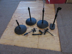 lot 231 image: 4 SHORT MIRCROPHONE STANDS AND MISC. CLAMPS.