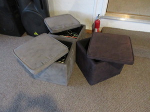 lot 233 image: STORAGE FOOTSTOOLS WITH CORDS AND ADAPTERS INSIDE