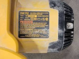 lot 93 image: DeWalt Compound Sliding Miter Saw (Defective Switch)