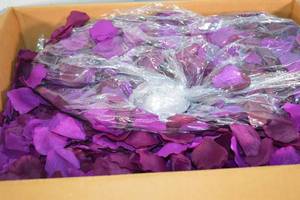 lot 36 image: Box of Artificial Flower Petals Purple