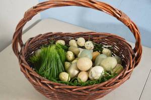 lot 56 image: Wicker Basket with Grass and Egg Decorations