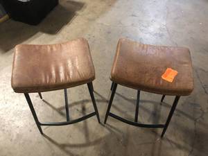 lot 13 image: Nathan James Arlo 27 in. Modern Backless Upholstered Counter Height Bar Stool with Metal Frame, BrownMatte Black, Set of 2  Customer Returns See Pictures