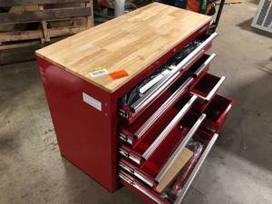 lot 17 image: Husky 42 in. W x 18.1 in. D 8-Drawer Red Mobile Workbench Cabinet with Solid Wood Top    Customer Returns See Pictures