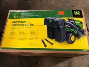 lot 36 image: John Deere 42 in. Twin Bagger for 100 Series Tractors  Customer Returns See Pictures