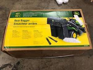 lot 32 image: John Deere 42 in. Twin Bagger for 100 Series Tractors Customer Returns See Pictures