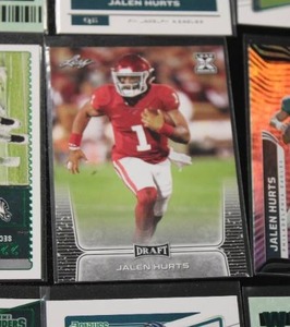 lot 75 image: Jalen Hurts Football Card Lot  20 Cards w 2020 Leaf Rookie Card & Scoring Materials Jersey Relic