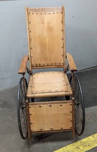 lot 32 image: Glendron Iron Wheel Co Hospital Wheel Chair from 1912