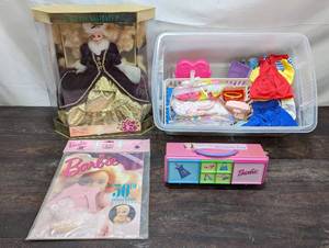 lot 67 image: Happy Holidays Special Edition Barbie And Box Of Barbie ClothesAccessories