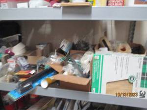Shelf full of hardware painting and other supplies