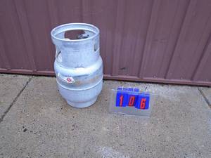 lot 106 image: Small forklift propane tank. Feels empty. As shown.
