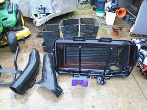 lot 108 image: 3 bag grass catcher. May be missing a bracket & some hardware. As shown.