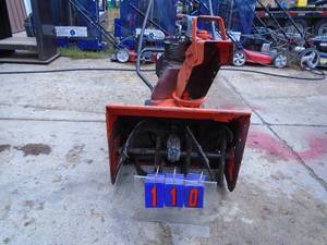 lot 110 image: 20 snow blower 9 cubic inch engine. Used condition. Tested & works. As shown.