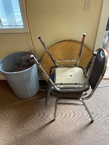Two chairs, tale tops and a can ful...