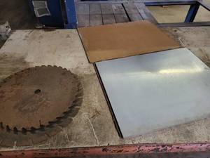 Solid Aluminum Plate (18 x 23 x 38) and (2) Saw Blades (16 and 18 Diameter)