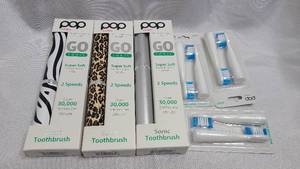 3 pack of New POP Sonic portable electric toothbrushes with 3 replacement heads