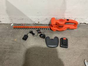 lot 61 image: Black  Decker 20V MAX Cordless Hedge Trimmer, Battery & Charger Included
