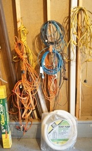 lot 44 image: Garage Accessories Long Heavy Duty Extension Cords, Jumper Cables, Window Insulation Etc...