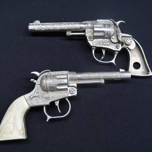 lot 63 image: GENE AUTRY CAP GUN PLUS