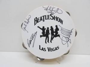 lot 11 image: Autographed Tambourine from The BEATLES SHOW in Las Vegas