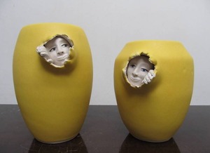 lot 140 image: Pair of Signed Lydia Grey Art Pottery Yellow Vases wEmerging Faces